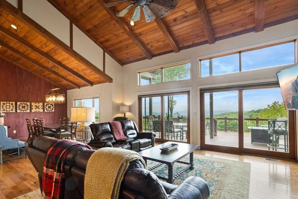 Expansive Great Room with High Vaulted Ceiling and Wall of Windows