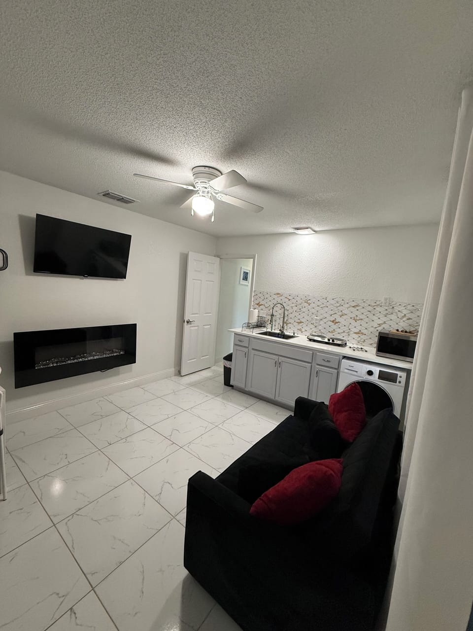 Kitchenette recently remodeled and all-in-one washer and dryer 