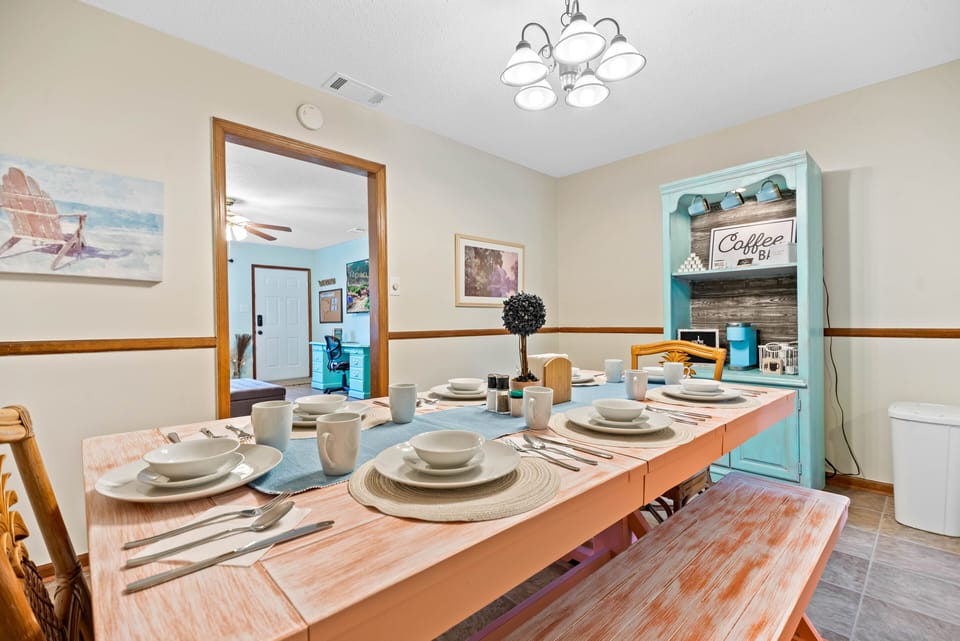 The dining room's spacious custom painted table can comfortably seat 8 
