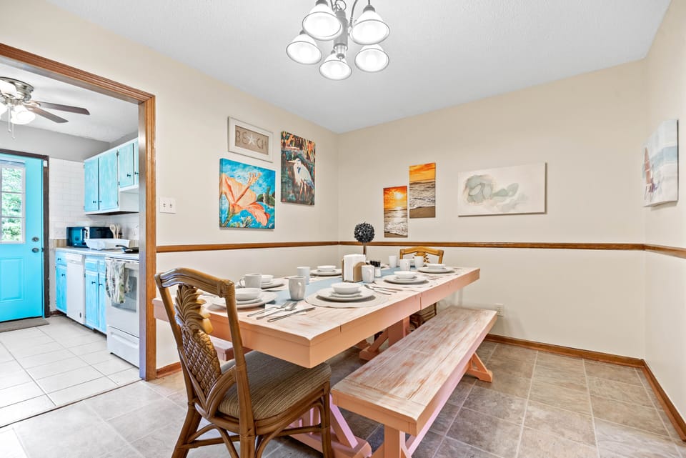 The dining room's spacious custom painted table can comfortably seat 8 