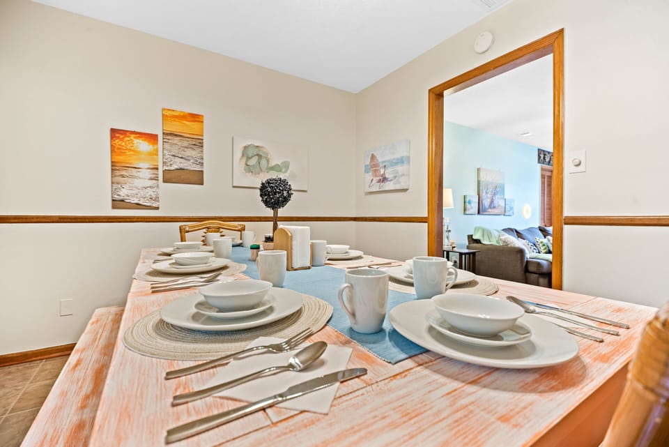 The dining room's spacious custom painted table can comfortably seat 8 