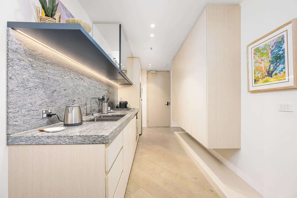Sleek hallway leading to open living space