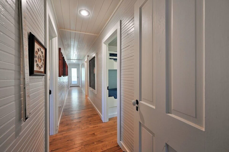 Leading off the living room the hallway provides access to the 4 bedrooms and bathroom.