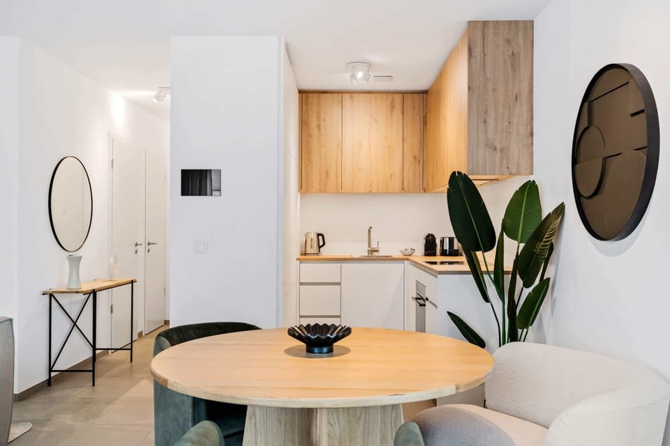 Elegant dining area meets modern kitchenette for your convenience and comfort.