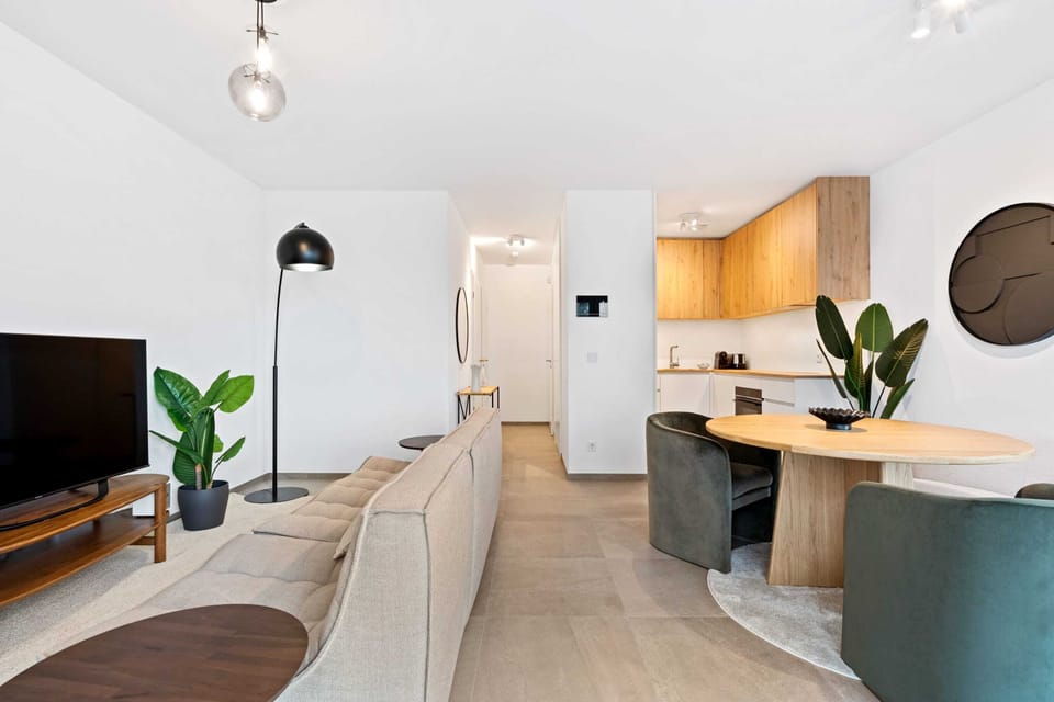 Our minimalist living room is the perfect spot to unwind and entertain.