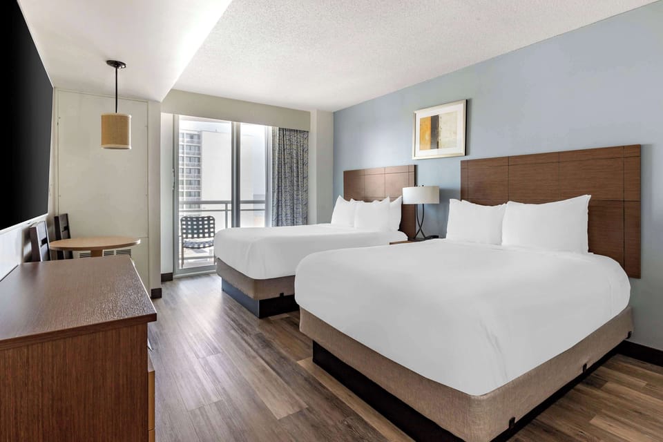 Stretch out on two queens in a calm, airy retreat.