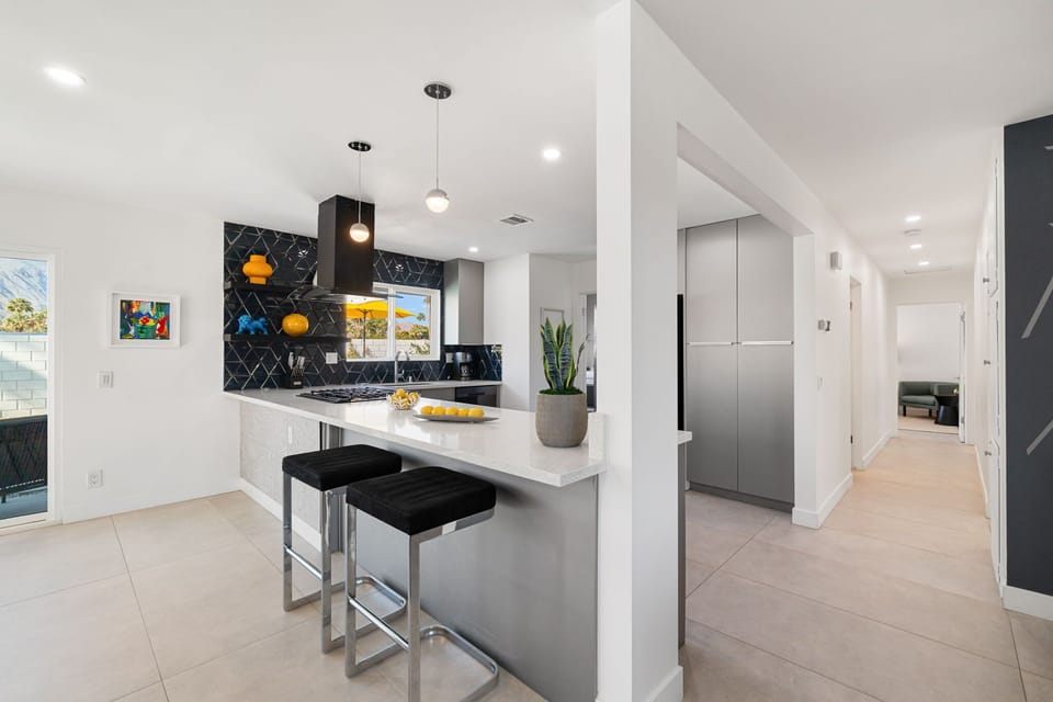 Dine indoors at the round table for 6 or enjoy casual bites at the kitchen bar.