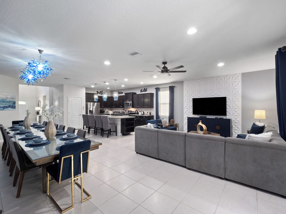 Spacious Downstairs Area with Full Size Kitchen, Dining Table, and Comfortable Lounge with Flat Screen TV