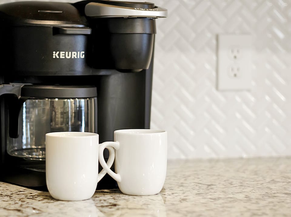 Modern Full Size Kitchen with Bar Stool Seating and Keurig Duo