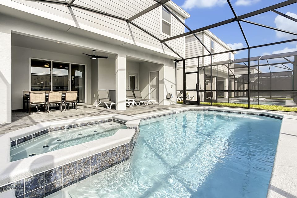 Luxurious Pool and Spa with Outdoor Furniture and Sun Loungers