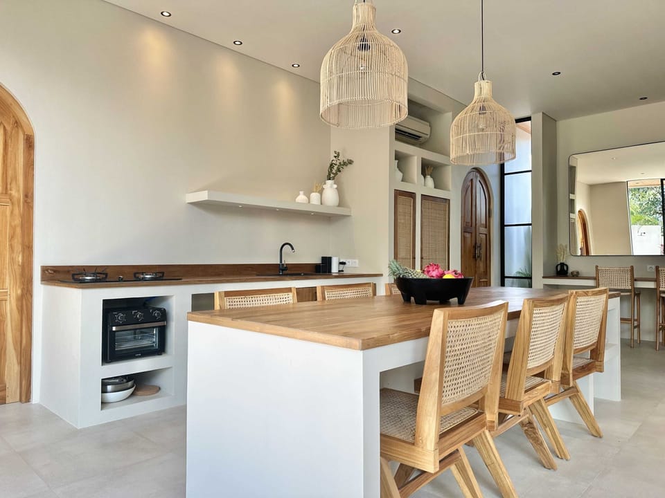 Fully equipped kitchen and a dining area