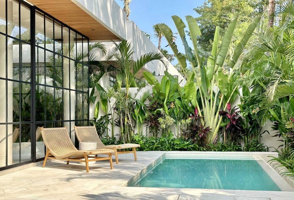Outdoor area with a swimming pool and a lounge