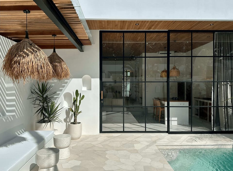 Sunny outdoor area with a swimming pool and lounge