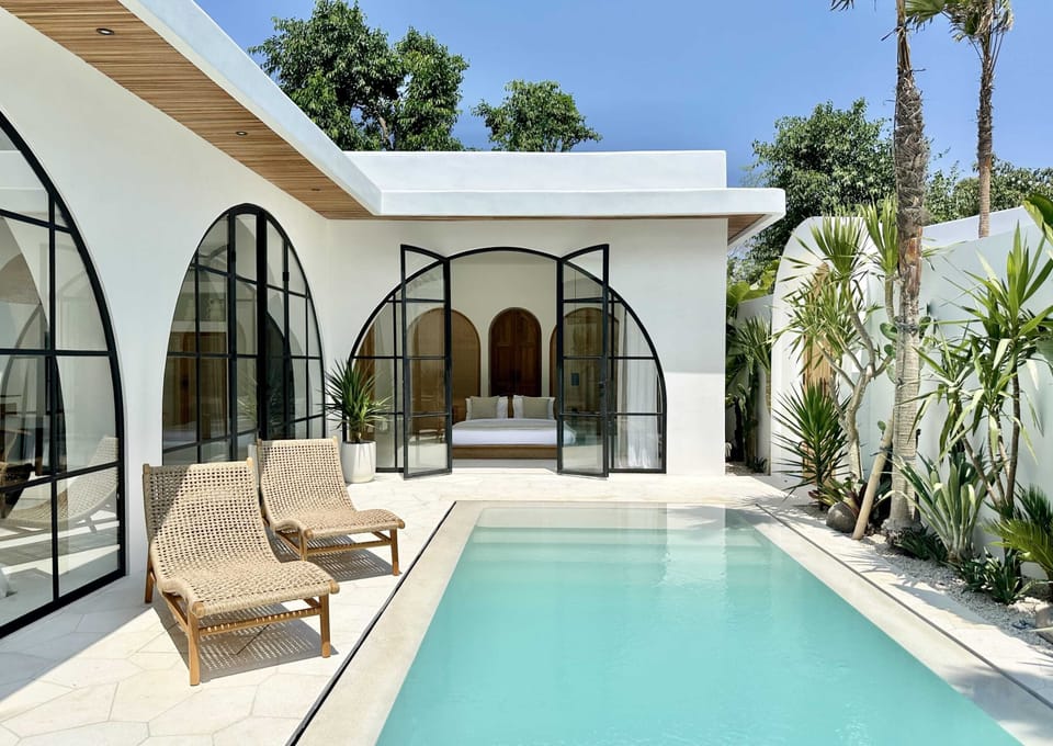 Outdoor area with a private pool and two lounge chairs