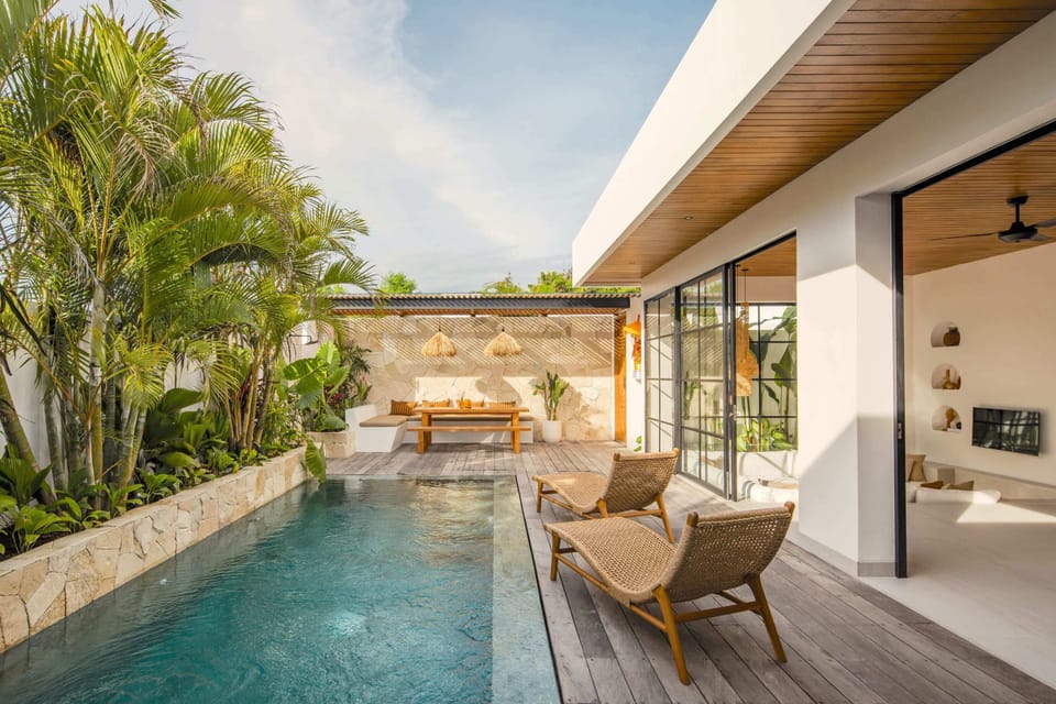 Private swimming pool with daybeds