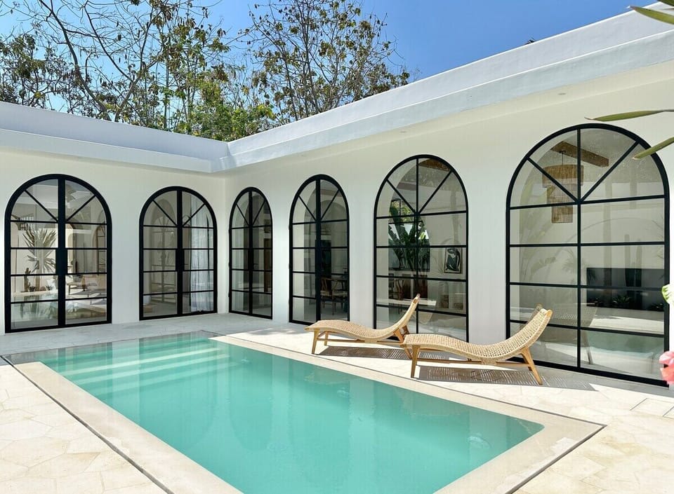 Private large swimming pool with two daybeds