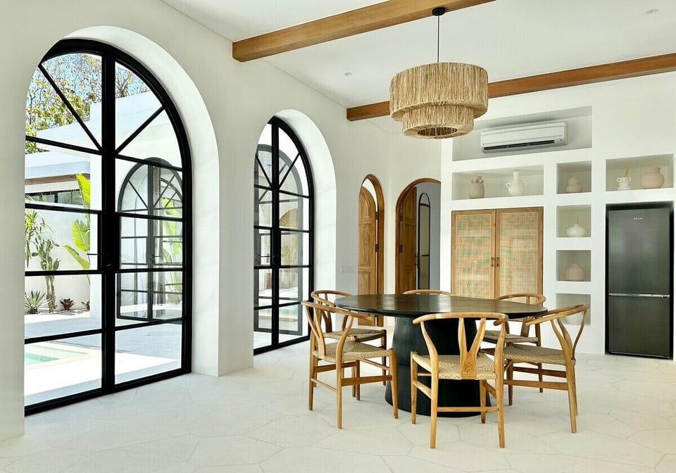 Fully equipped kitchen with a full-size fridge, water dispenser, stove, oven, and everything you might need for cooking. 