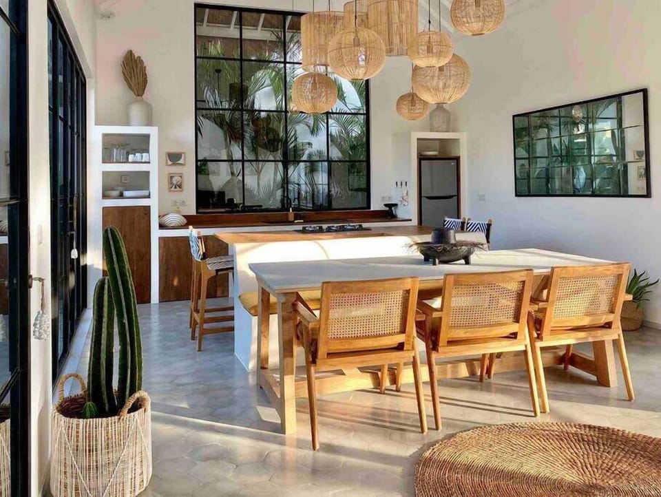 Our open concept kitchen with large window behind the kitchen sink. 
