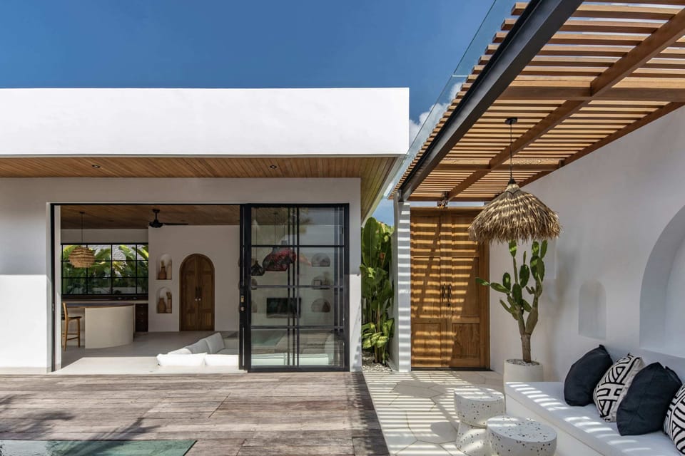 View to the living room and outdoor lounge.