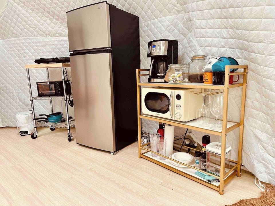 kitchenette includes electric cooktop, with pots & pan, toaster oven, microwave, and gas grill outside. 12-cup coffee maker with organic coffee, cream, and sugar provided. 