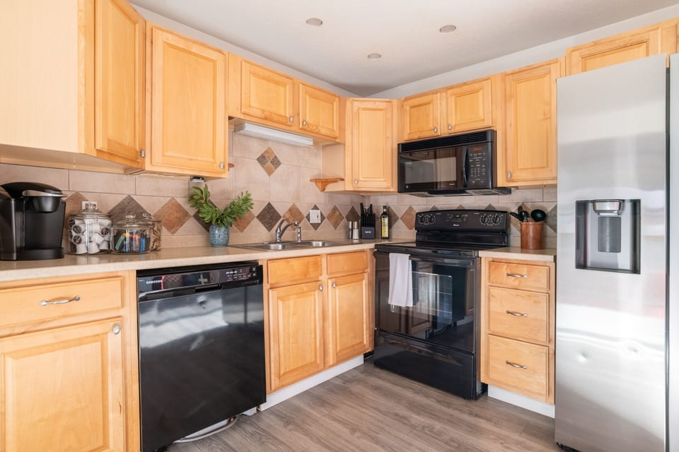 The kitchen is fully equipped with modern appliances
