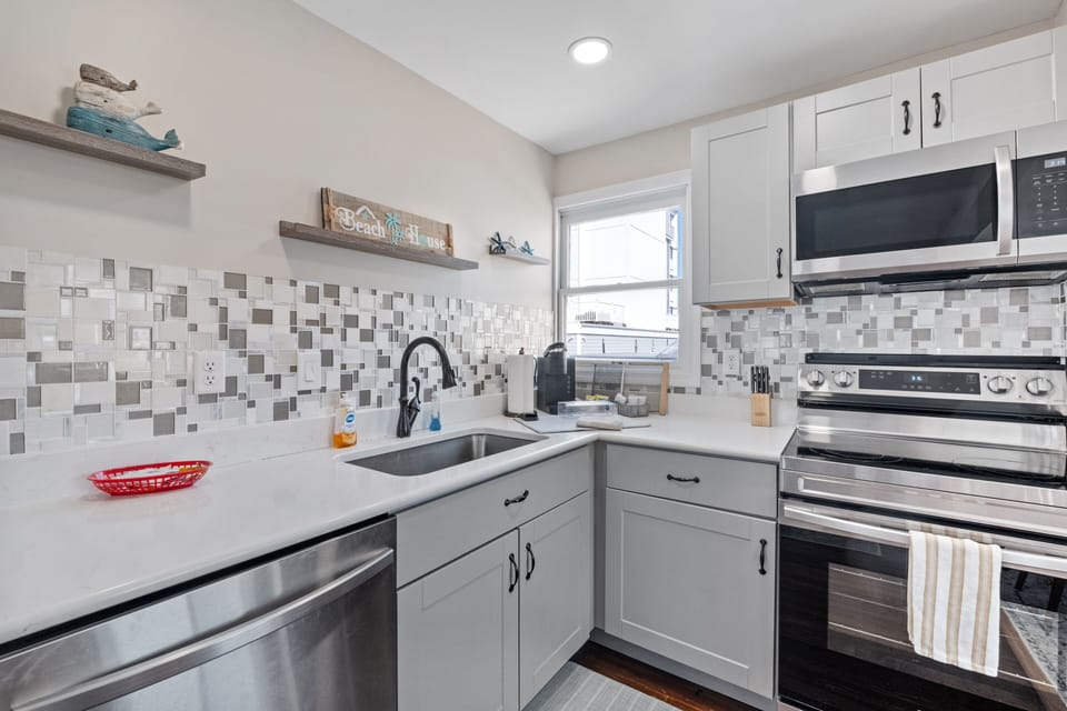 Kitchen is stocked with utensils and cookware needed to prepare meals.