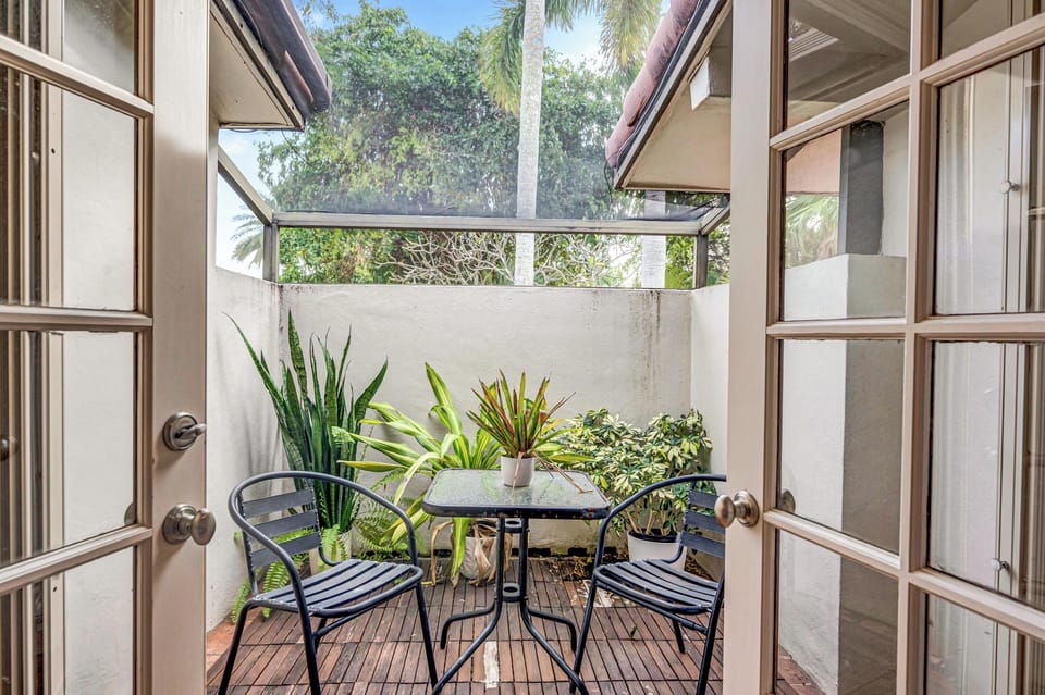 The second bedroom features a queen size bed and a separate patio.