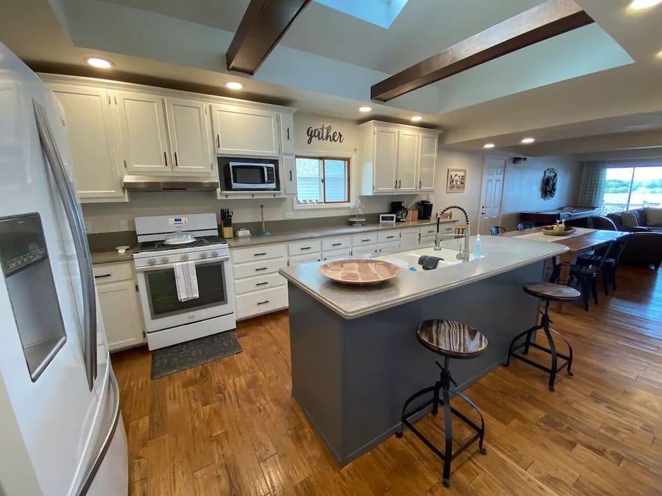 Large, spacious kitchen with skylights! Modern appliances and a coffee maker. 