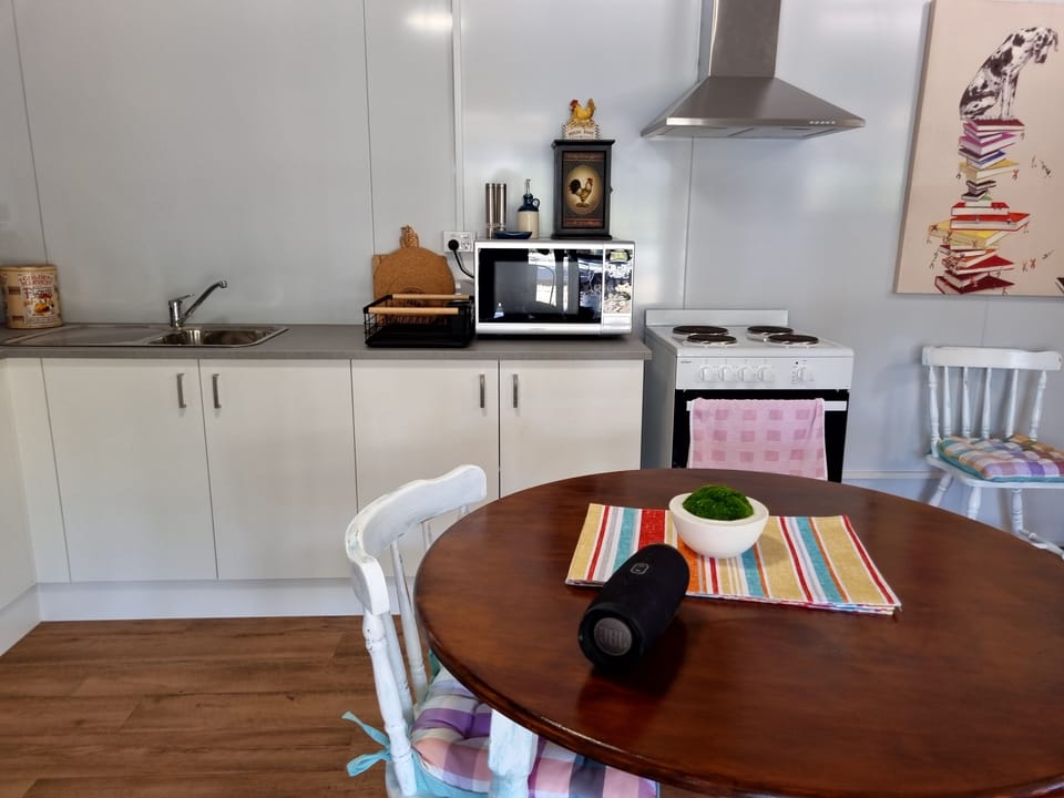 Kitchen  - Toaster  - Table with Four Chairs, Stove, Oven and Microwave