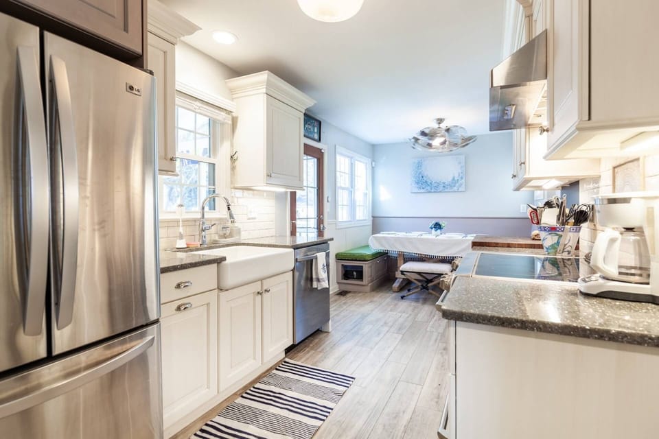 The kitchen is conveniently located in the middle of the home.