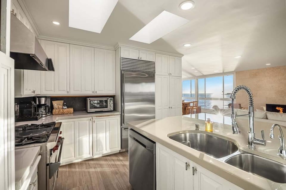 A bright, fully stocked kitchen with high-end appliances and thoughtful design.