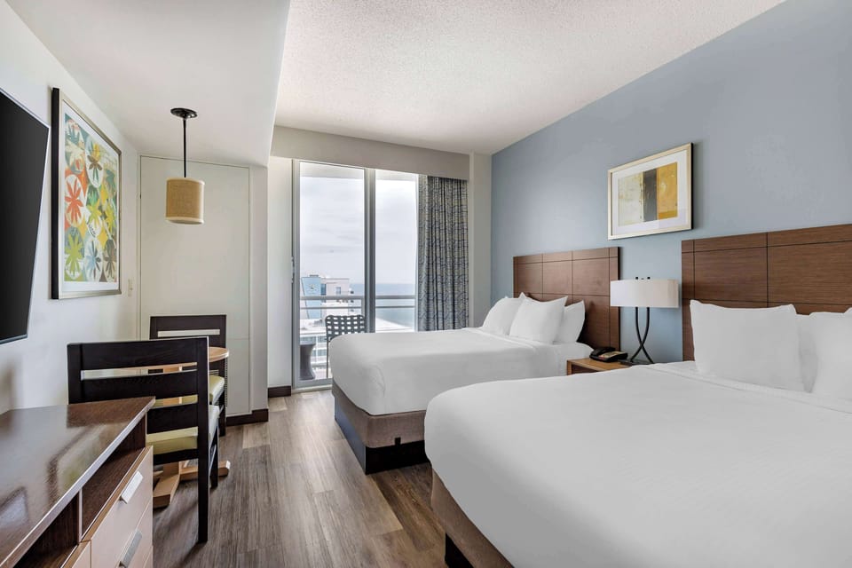 Wake up to coastal light and step onto the balcony.
