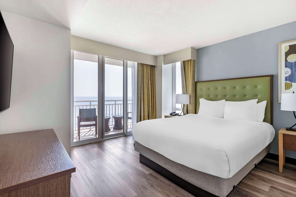 Unwind in a sunlit bed with sweeping sea views.
