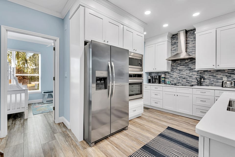 2nd Floor - 🍽️ Fully Equipped Kitchen – Stainless steel appliances, breakfast bar, and open layout