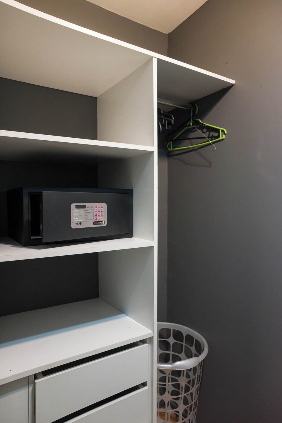 Keep your valuables secure with the in-room safe built into the closet. Enjoy ample shelf and drawer space along with hangers and a basket to keep the space tidy.