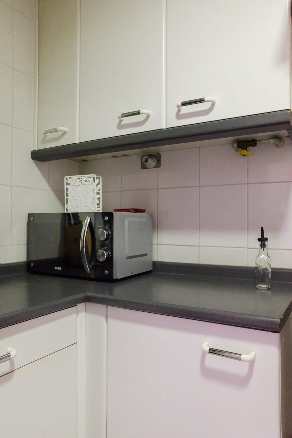 Cozy kitchen corner equipped with essentials for your stay.