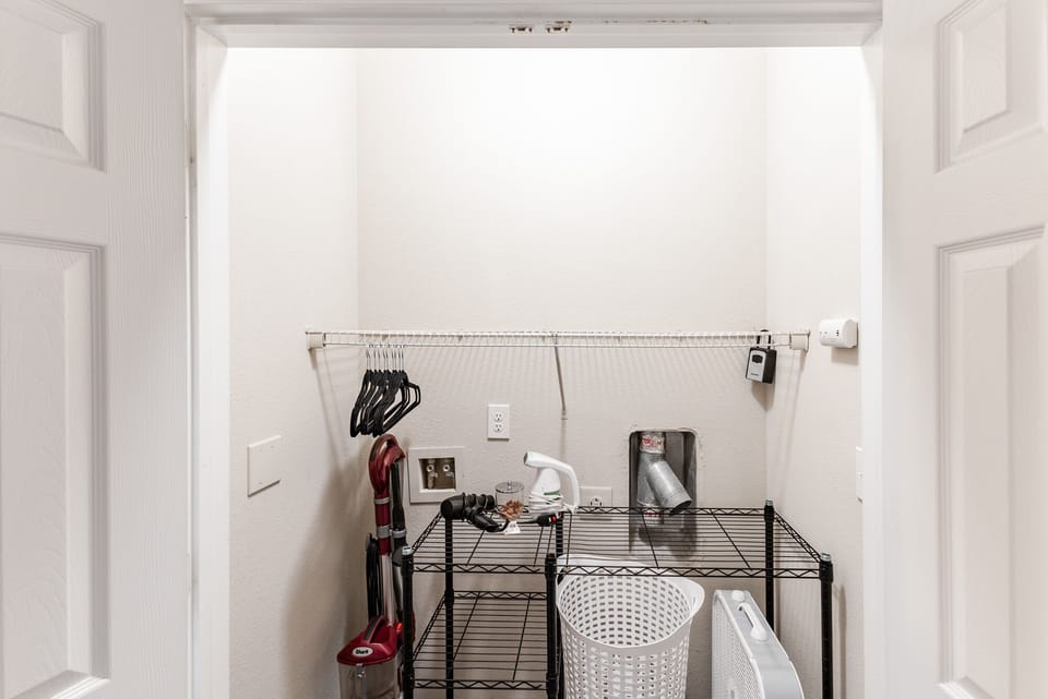 closet with hair dryer and steamer