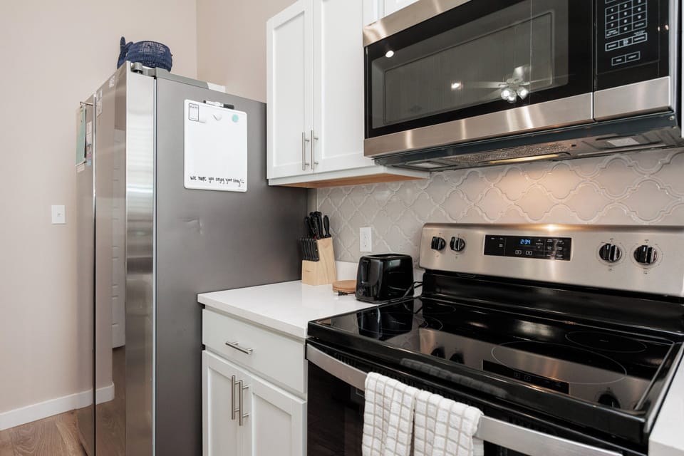 Your fully equipped kitchen features stainless steel appliances and modern conveniences for preparing home-cooked meals during your stay.