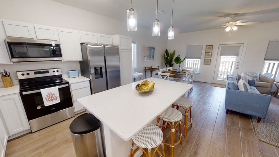 You'll love cooking in this bright open kitchen with modern appliances and spacious island seating for casual meals with family.