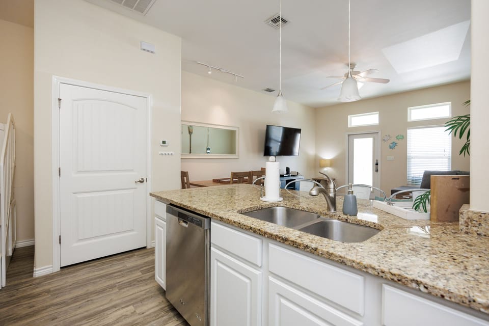 Your modern kitchen features granite counters, stainless appliances, and opens to bright living spaces for easy entertaining.