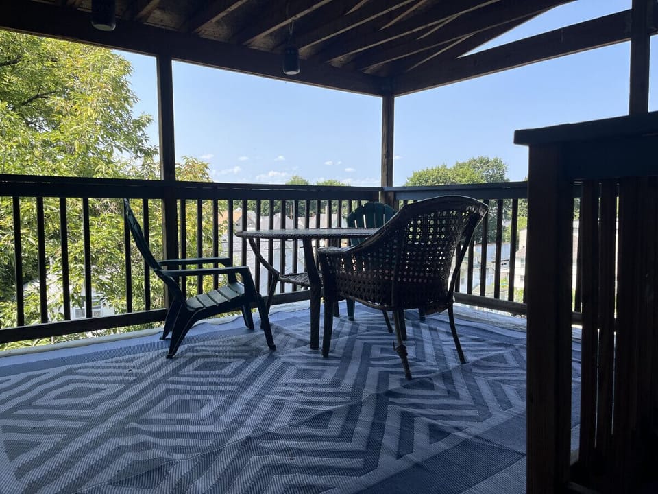 Enjoy this outdoor living area.  Comfortably furnished to enjoy your morning coffee or wind down your evening.  1 flight down to the kitchen and outdoor eating area.