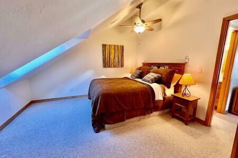 The second bedroom offers privacy and a view that creates a sense of seclusion.