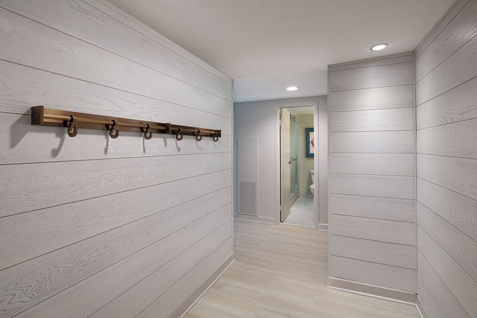 Arrive with ease through a calm, modern entry hallway.