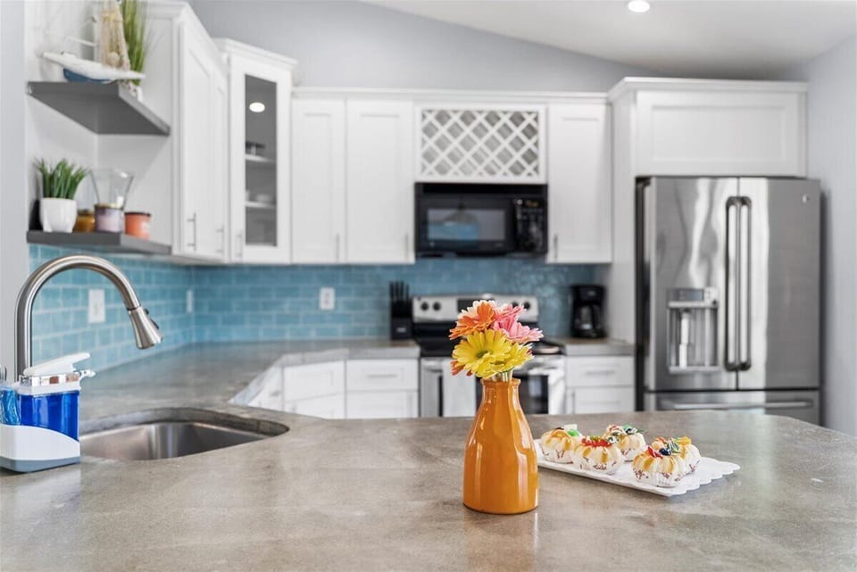 Full Kitchen stocked with all the utensils, pots, pans, appliances you need.