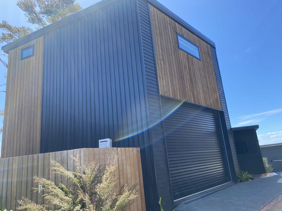 House from driveway entrance with double garage internal access