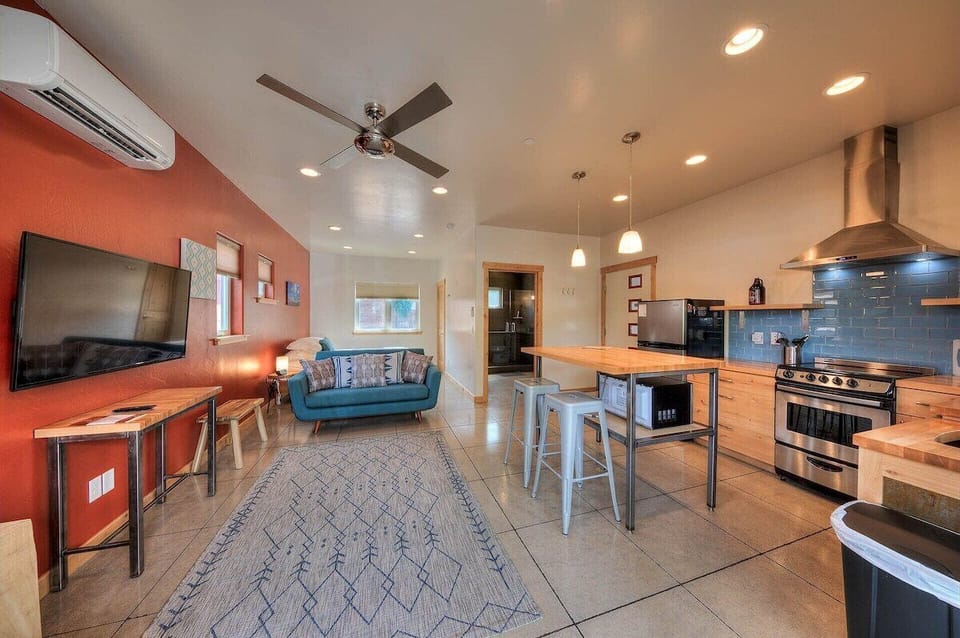 Family room and kitchen areas with high ceilings