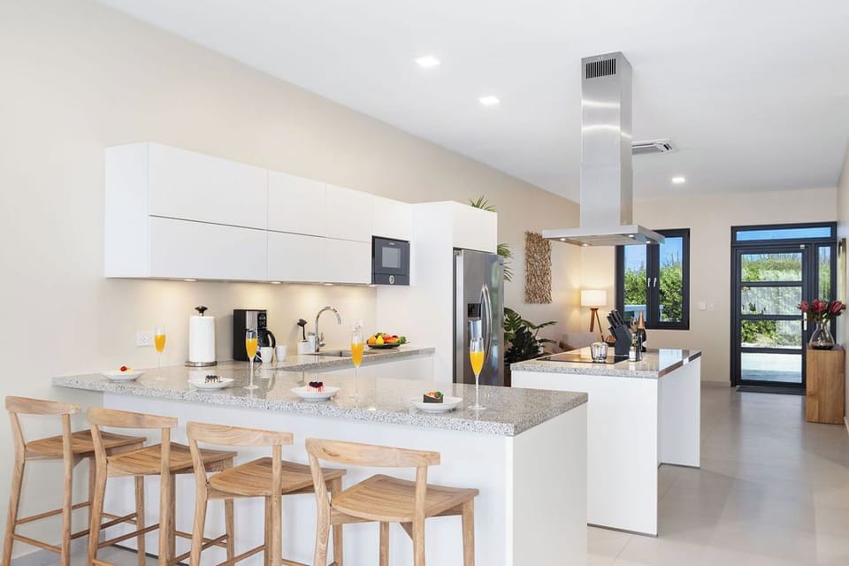 Sip, chat, and enjoy casual meals at our kitchen bar with seating for 4, where stylish design meets comfort for an inviting culinary experience.