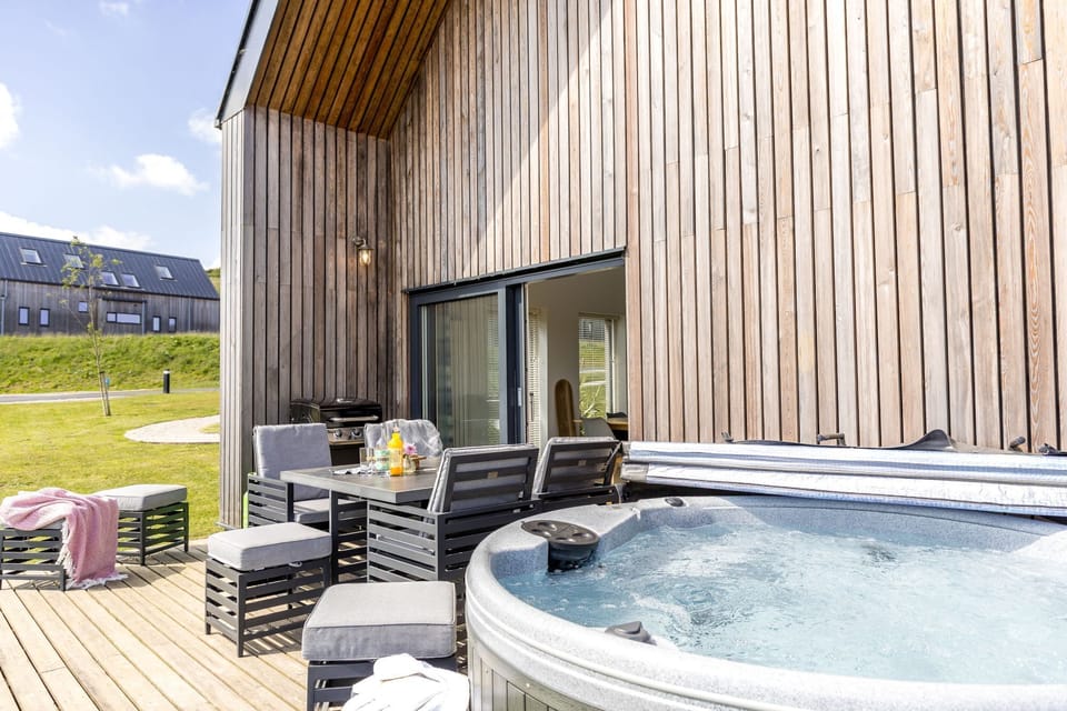 Decked patio with electric hot tub and table seating for eight -  1 The Vista, Willingcott