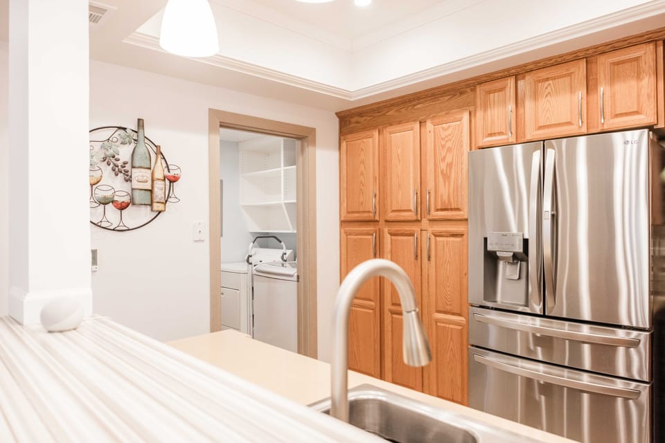 Washer and dryer located adjacent to the kitchen