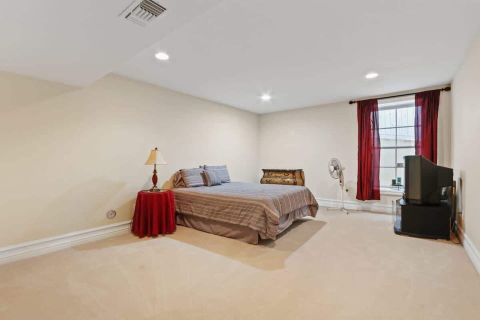 This cozy spare bedroom, located near the game room and second master, offers the perfect retreat for unwinding. With easy access to entertainment and privacy, it’s ideal for extra guests or family seeking comfort and relaxation.